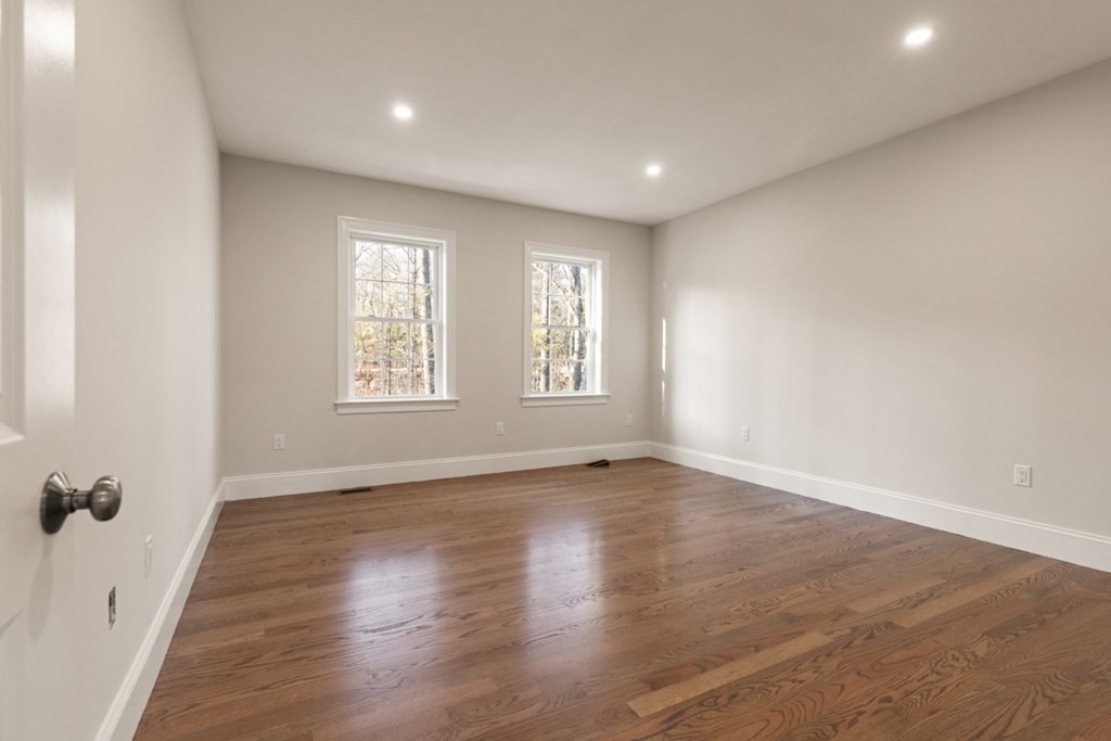 21 Vera Road Middleton, MA 01949 - Photo 18 of 41 an empty room with wooden floor and windows