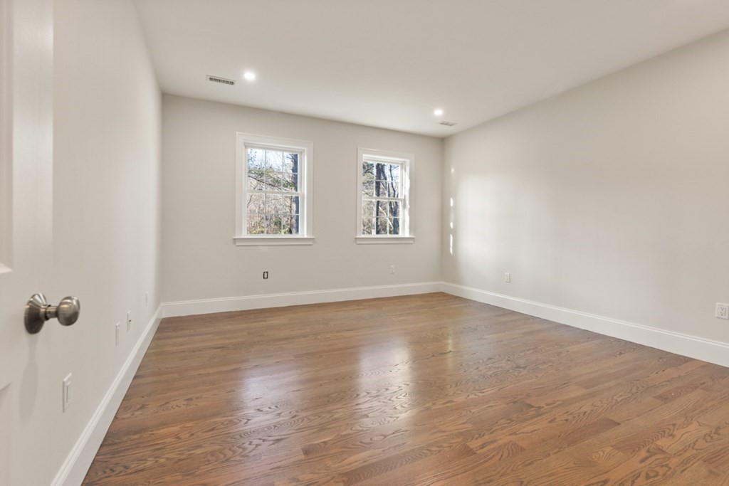 21 Vera Road Middleton, MA 01949 - Photo 19 of 41 an empty room with wooden floor and windows