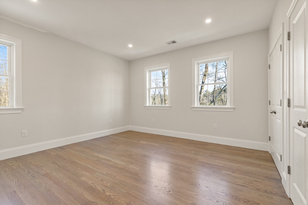 21 Vera Road Middleton, MA 01949 - Photo 20 of 41 an empty room with wooden floor and windows