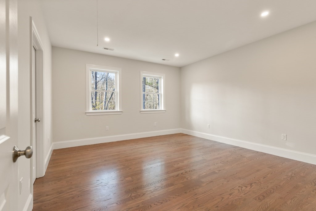 21 Vera Road Middleton, MA 01949 - Photo 21 of 41 an empty room with wooden floor and windows