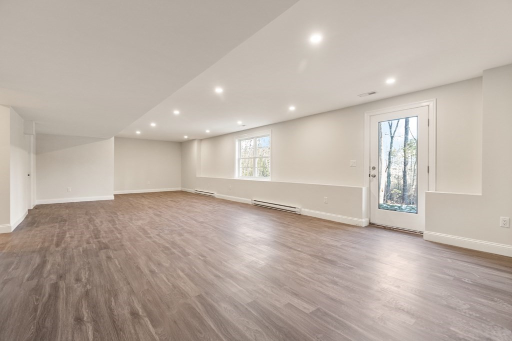 21 Vera Road Middleton, MA 01949 - Photo 30 of 41 an empty room with wooden floor and windows