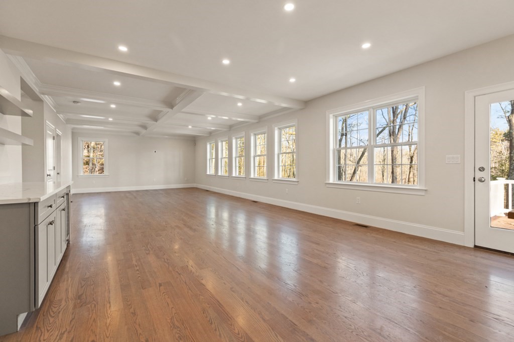 21 Vera Road Middleton, MA 01949 - Photo 8 of 41 an empty room with wooden floor and windows