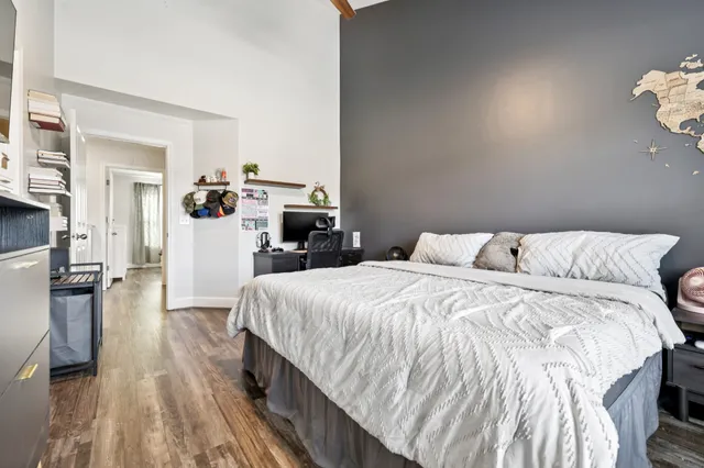 a bed room with a bed and a table