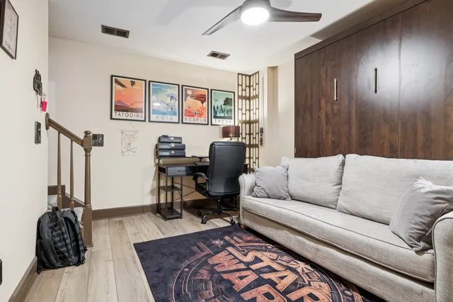 a living room with furniture and a window