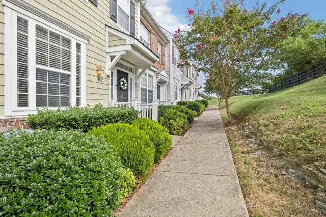 a view of a pathway with a house