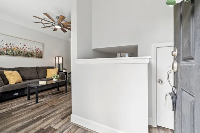 a living room with furniture and a table