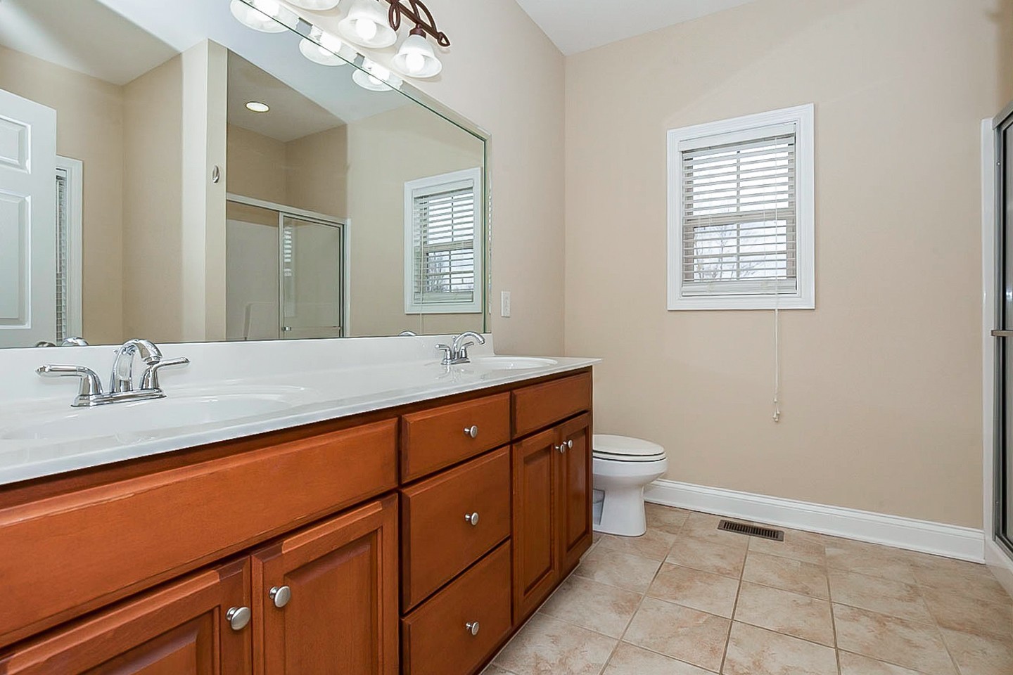 1008 Bradshaw Road Lebanon, TN 37087 - Photo 14 of 21 a bathroom with a granite countertop sink a toilet and a mirror