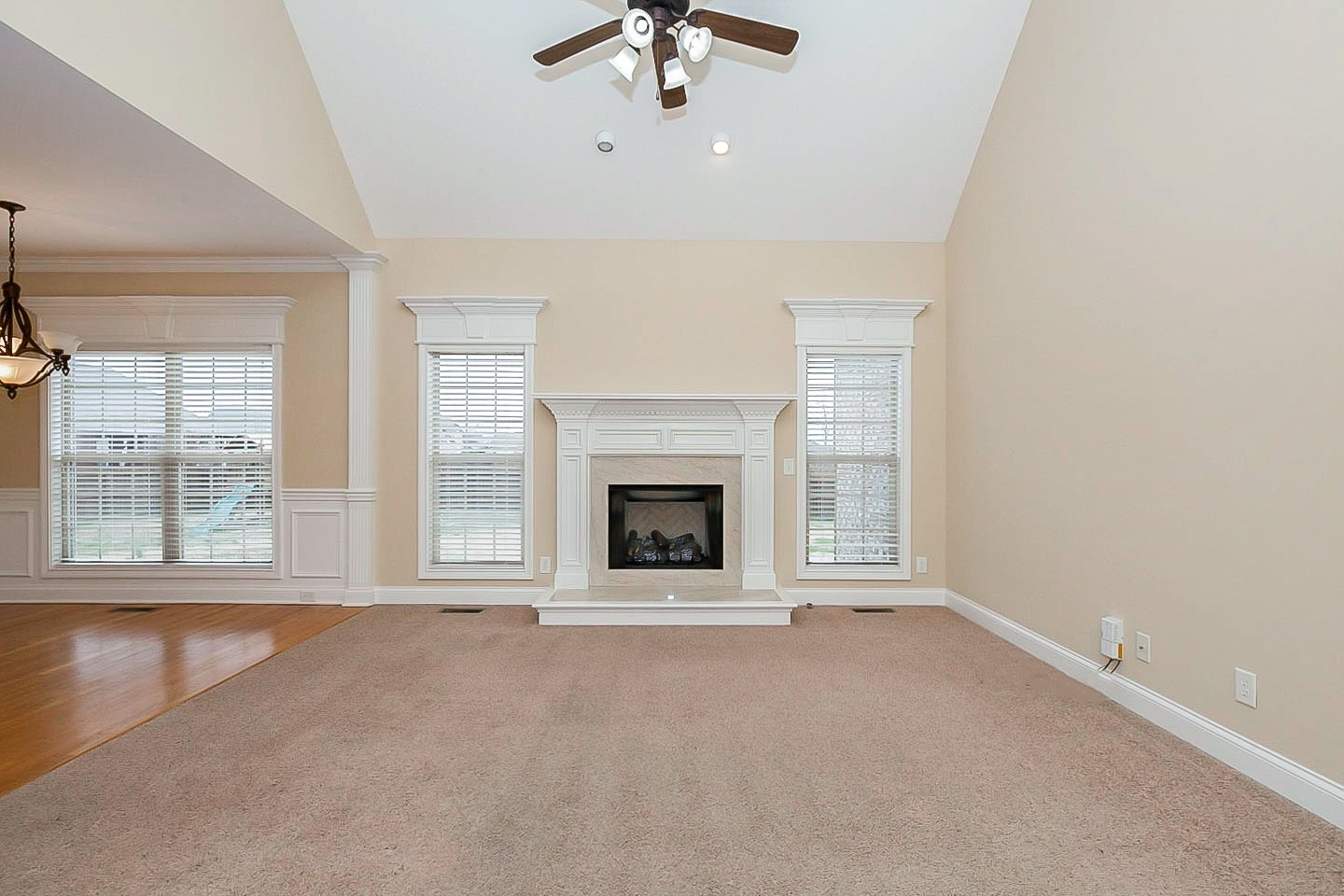 1008 Bradshaw Road Lebanon, TN 37087 - Photo 3 of 21 a view of an empty room with a fireplace and a window