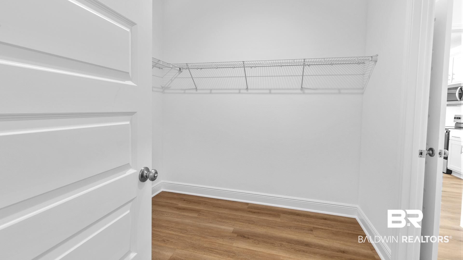 12931 Grand Rpds Road Fairhope, AL 36532 - Photo 27 of 33 Walk in closet featuring wood finished floors