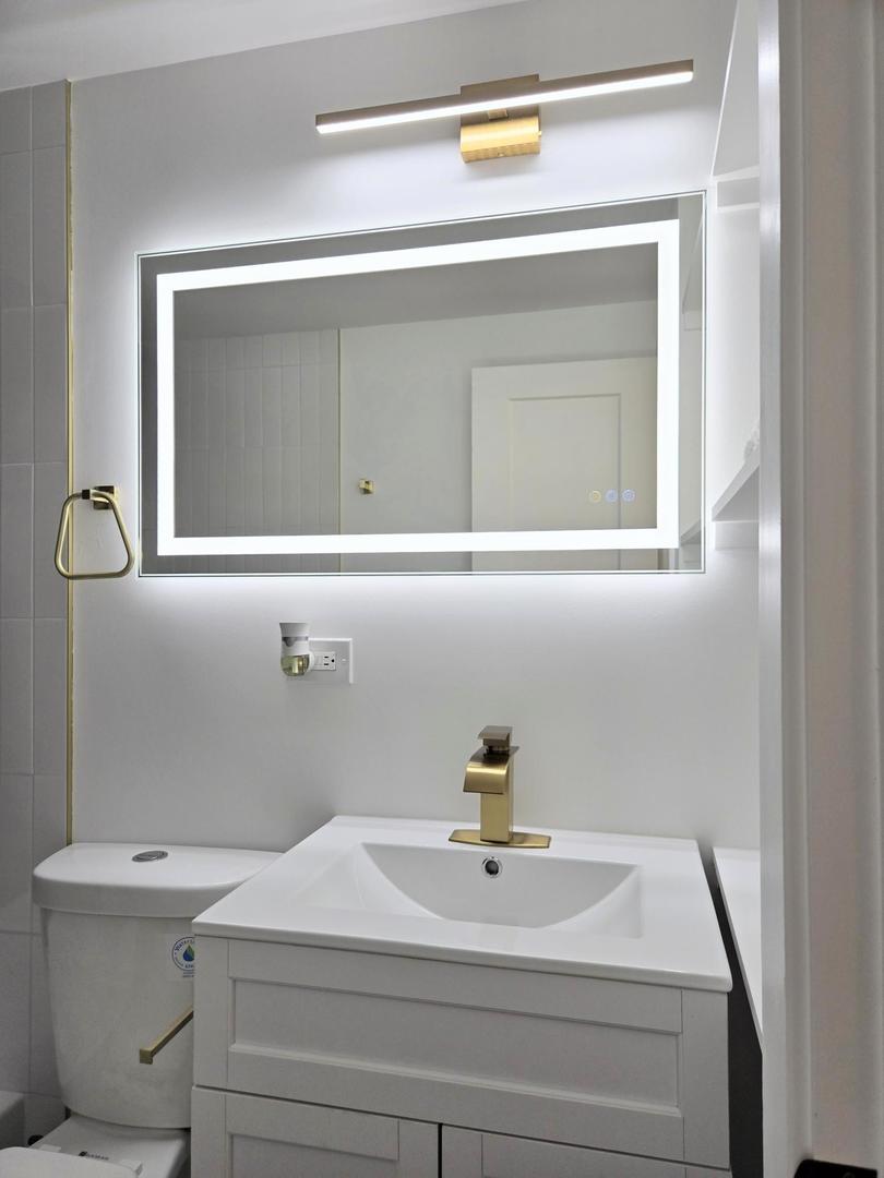 16536 Wolcott Avenue Markham, IL 60428 - Photo 14 of 18 a bathroom with a sink and mirror