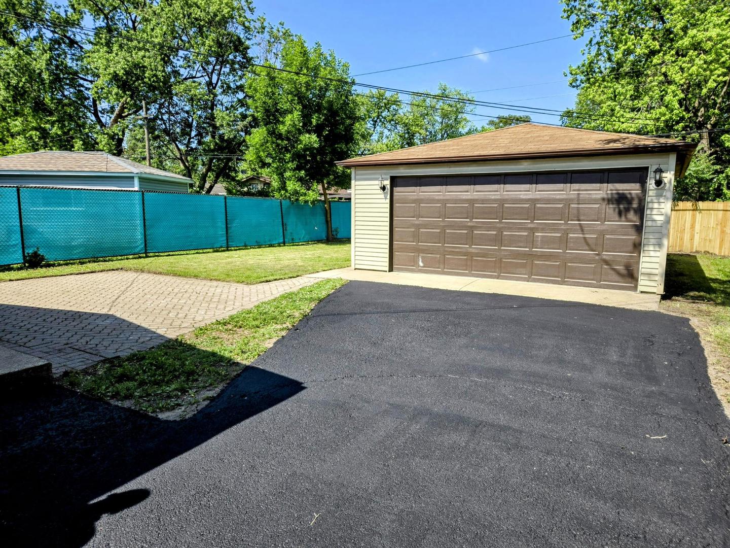 16536 Wolcott Avenue Markham, IL 60428 - Photo 17 of 18 a view of outdoor space yard and garage