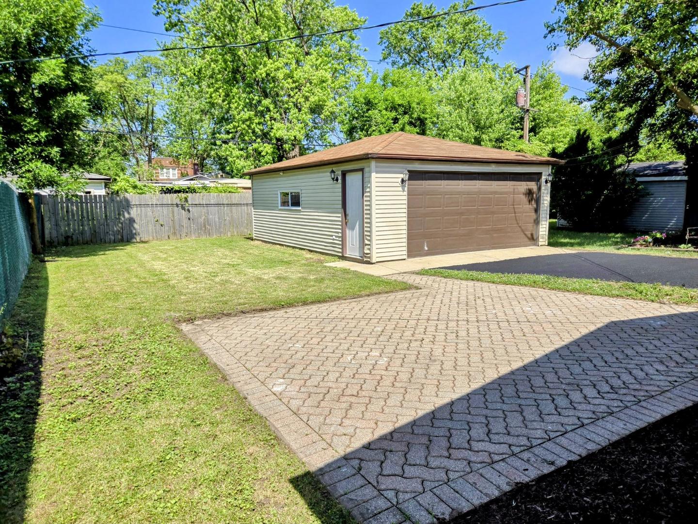 16536 Wolcott Avenue Markham, IL 60428 - Photo 18 of 18 a backyard of a house