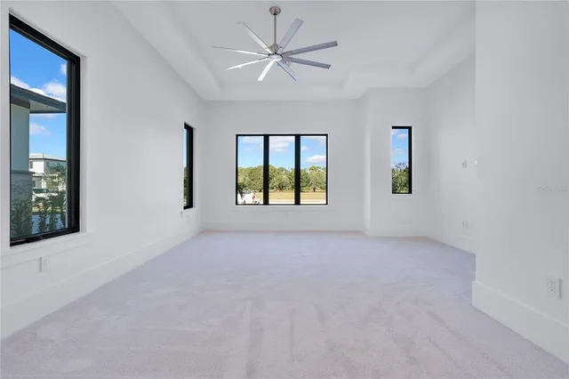 a bathroom with a sink a toilet and a large mirror