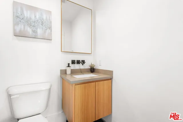 a bathroom with a toilet and a bathtub