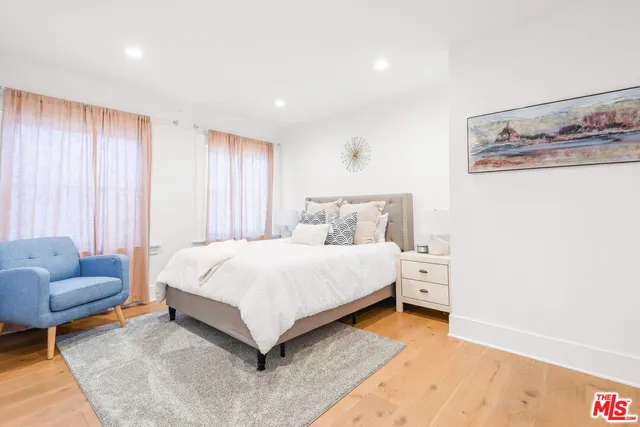 a bedroom with a bed and a dressers