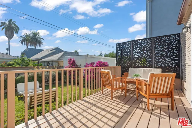 a view of a patio with a table and chairs