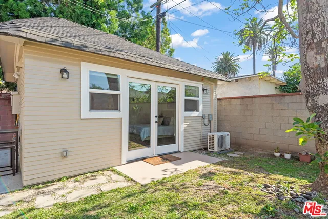 a bedroom with a bed and table