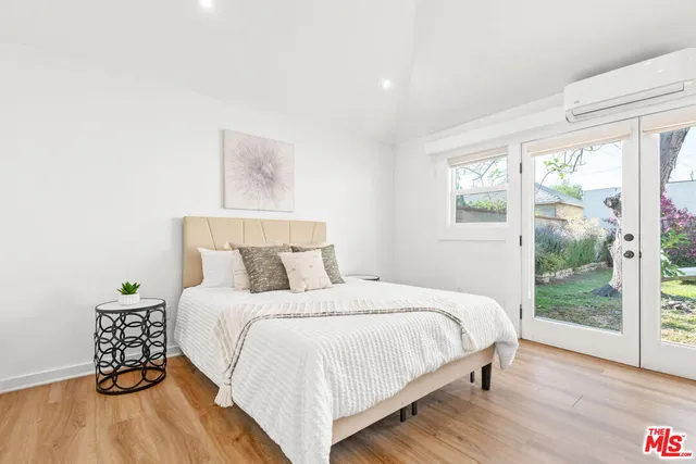 a kitchen with a stove a table and chairs