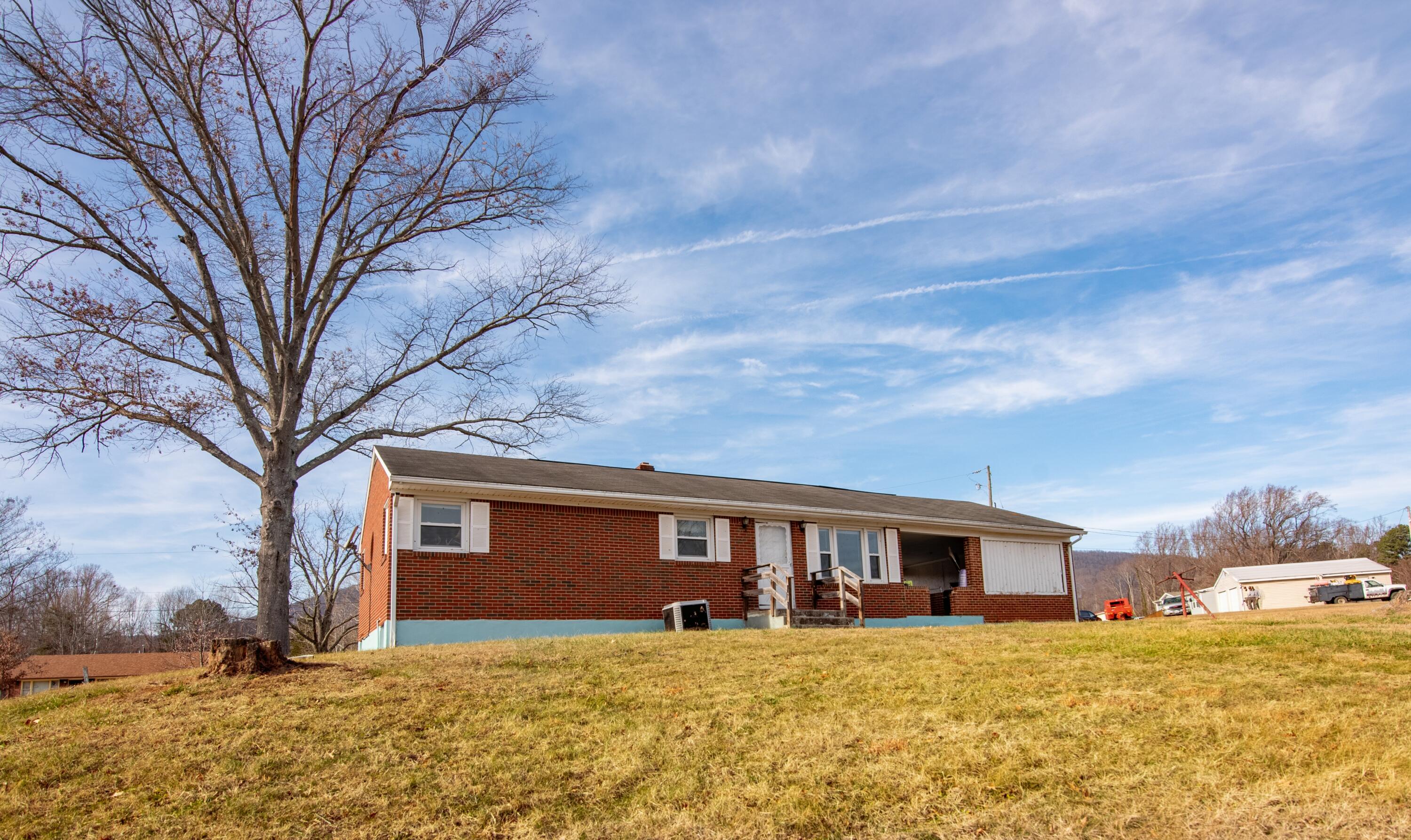 1065 Mountain Valley Road Vinton, VA 24179 - Photo 1 of 20 a house that has a tree in front of it