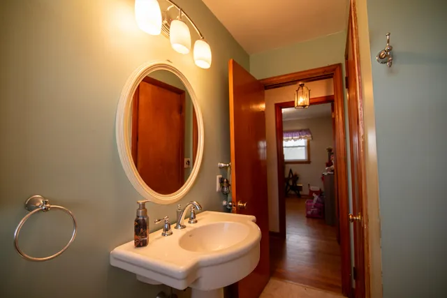 a bathroom with a sink and a mirror