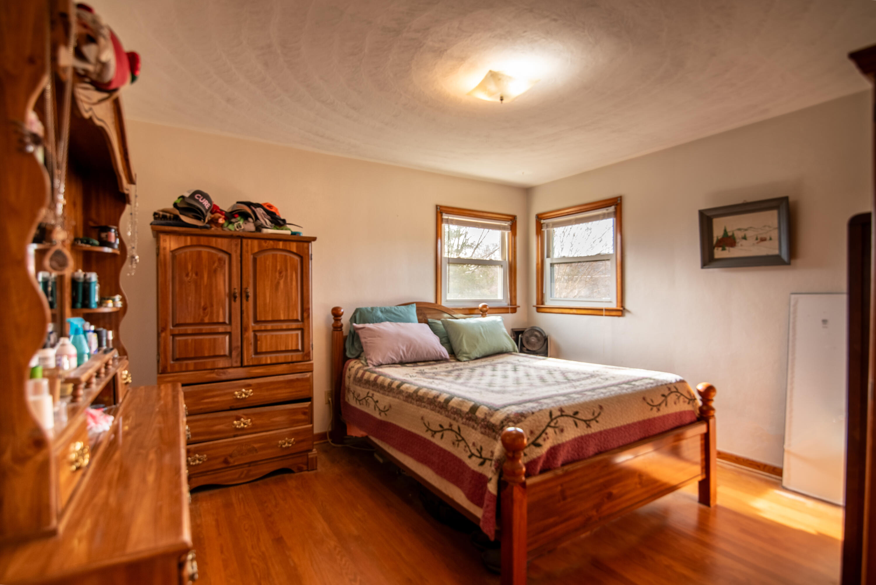 1065 Mountain Valley Road Vinton, VA 24179 - Photo 12 of 20 a bedroom with a bed and wooden floor