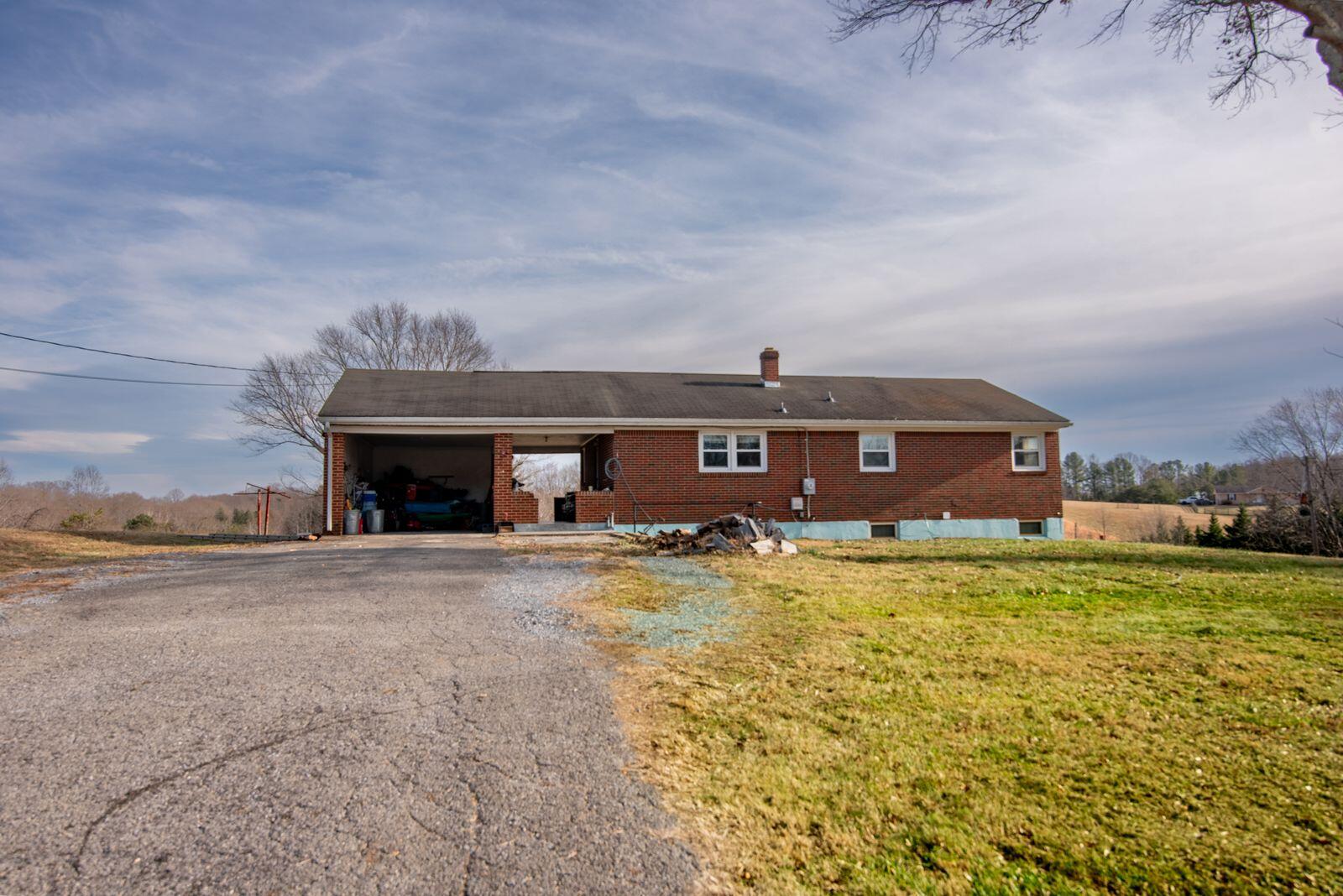 1065 Mountain Valley Road Vinton, VA 24179 - Photo 19 of 20 a view of a house with a swimming pool and a yard