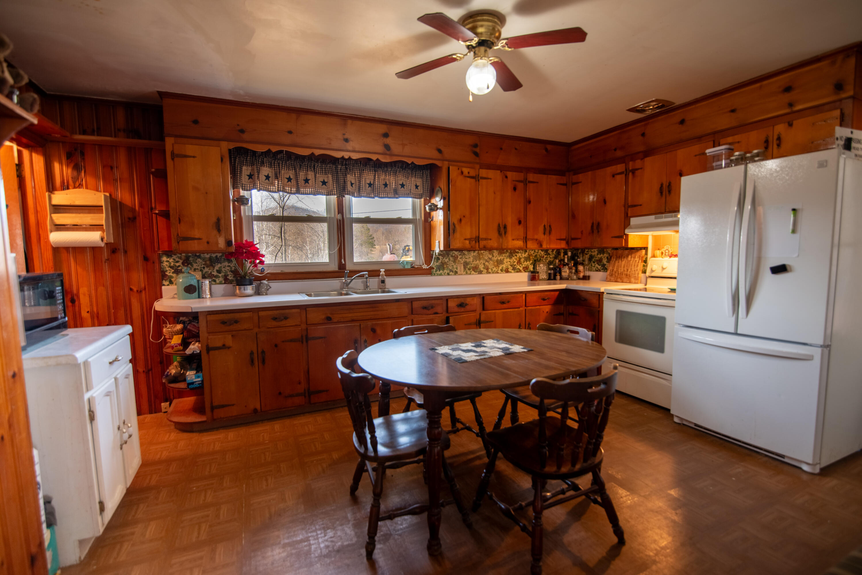 1065 Mountain Valley Road Vinton, VA 24179 - Photo 3 of 20 a kitchen with a table chairs refrigerator and sink