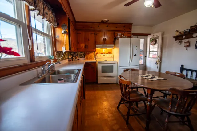 a view of a dining room with furniture window and outside view