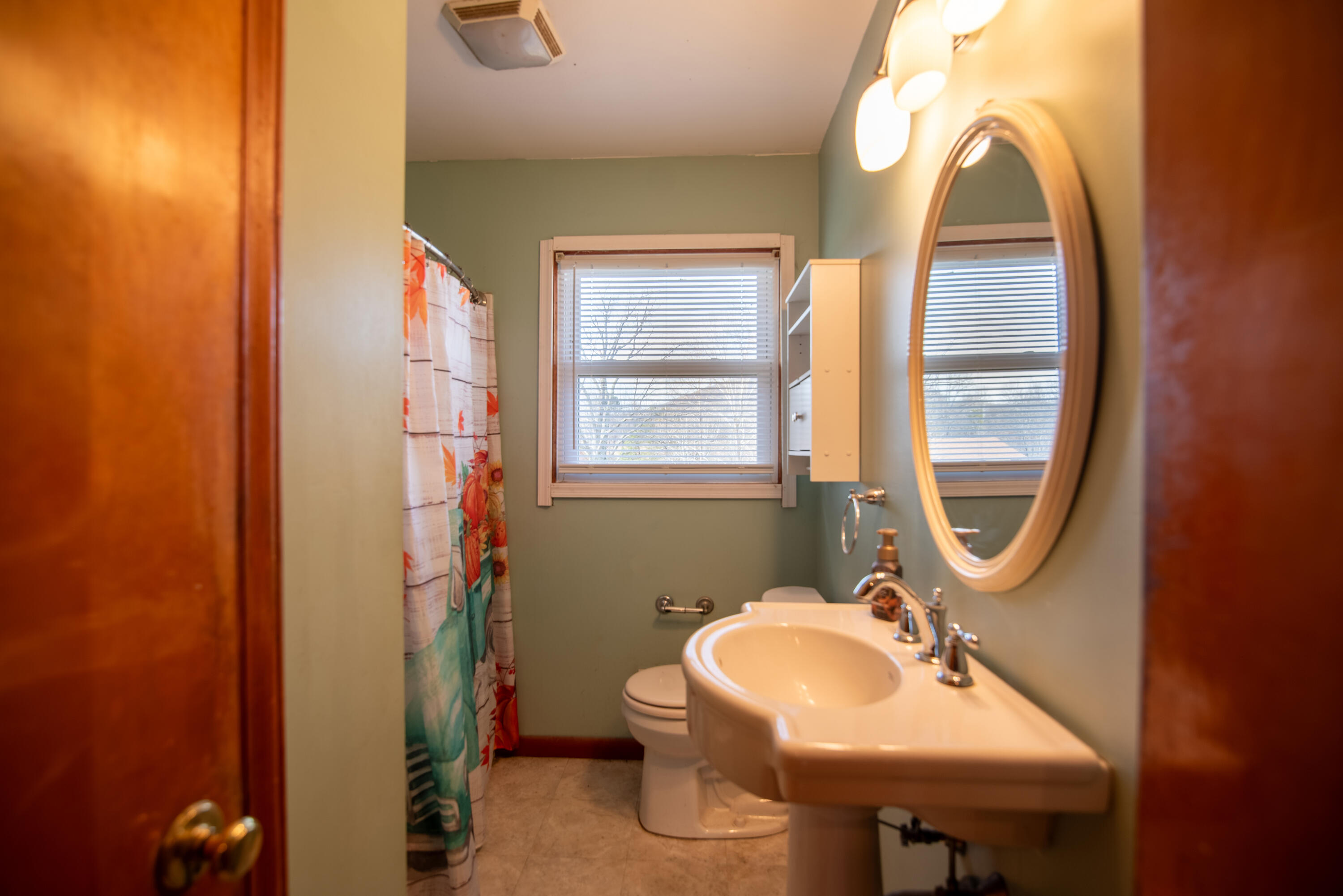 1065 Mountain Valley Road Vinton, VA 24179 - Photo 10 of 20 a bathroom with a sink toilet and a mirror