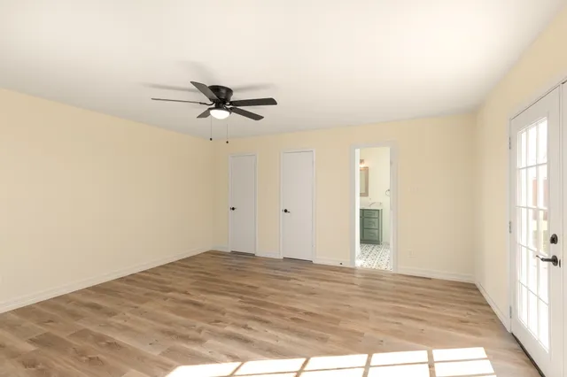 a bathroom with a double vanity sink mirror and bathtub