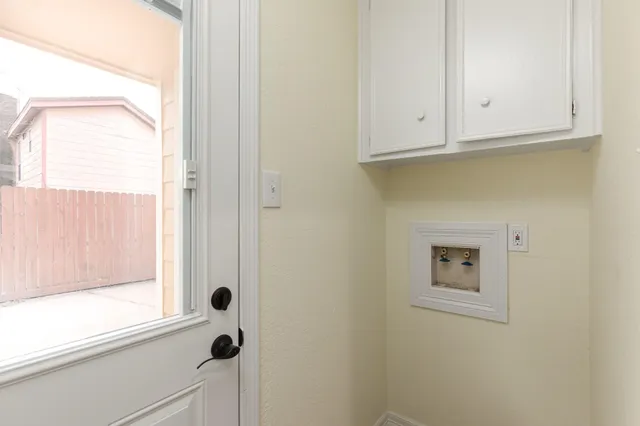 a view of an empty room and wooden floor