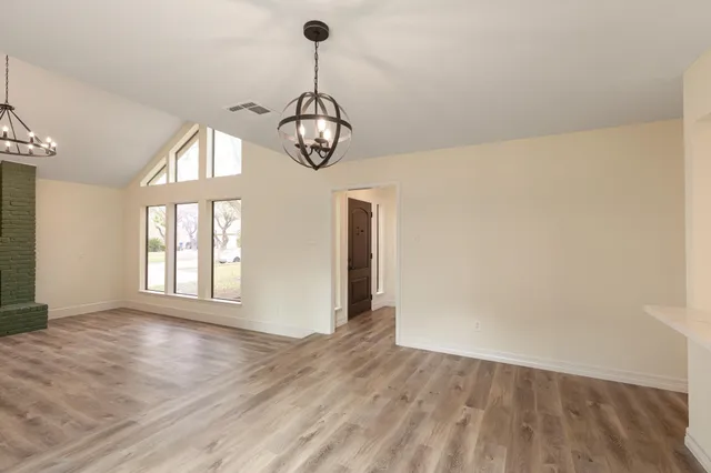 a kitchen with a sink a counter top space cabinets and stainless steel appliances