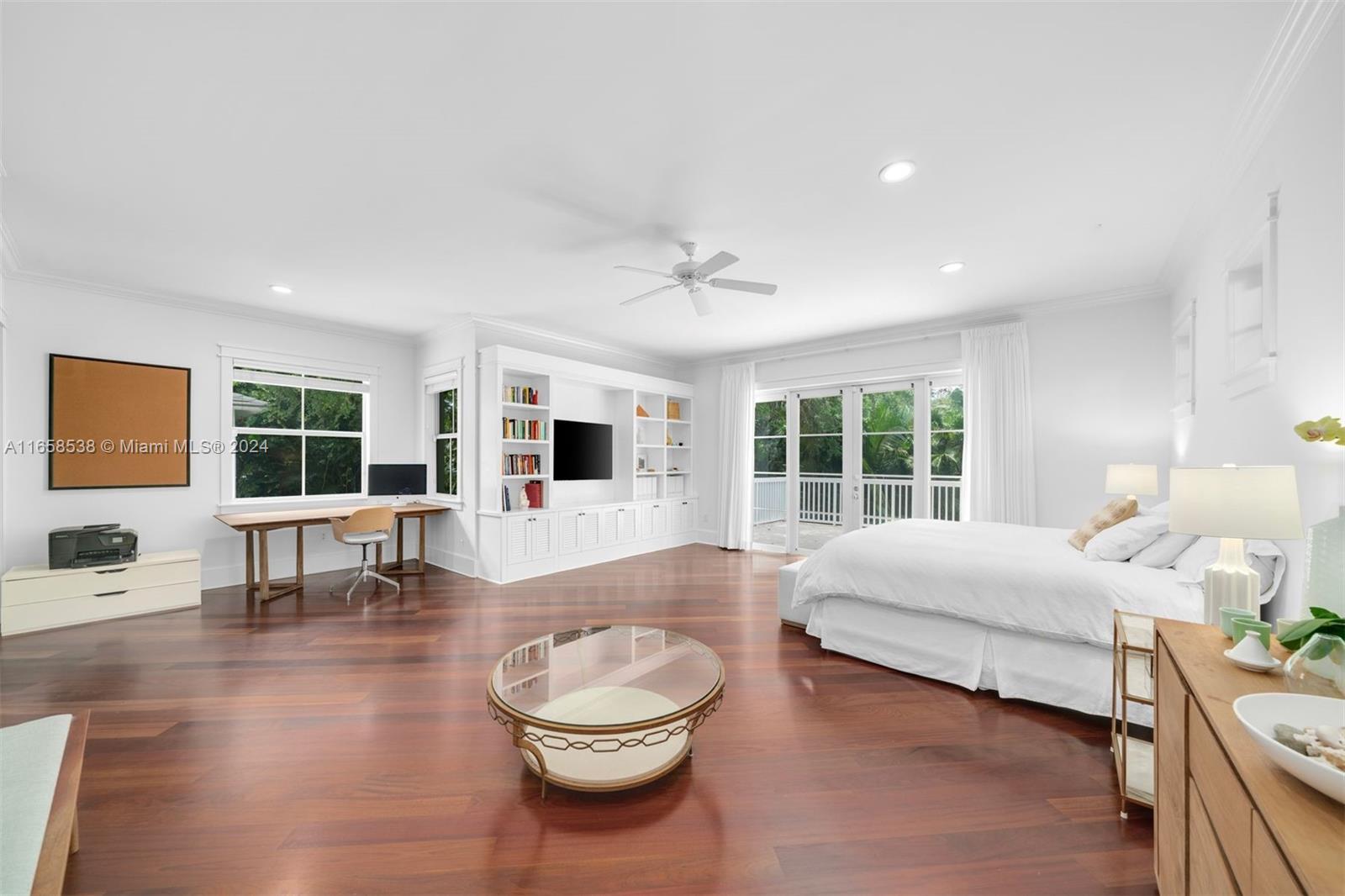 4050 Battersea Road Coconut Grove, FL 33133 - Photo 12 of 40 a living room with furniture and a large window