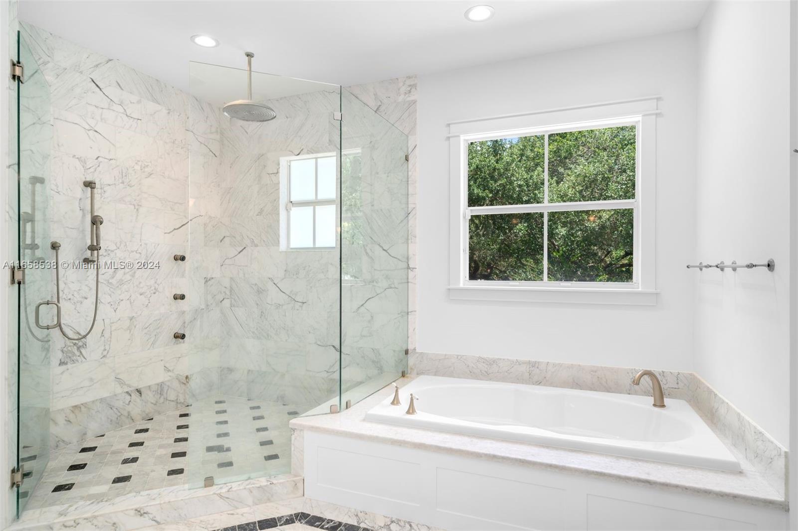 4050 Battersea Road Coconut Grove, FL 33133 - Photo 16 of 40 a bathroom with a bathtub and a shower