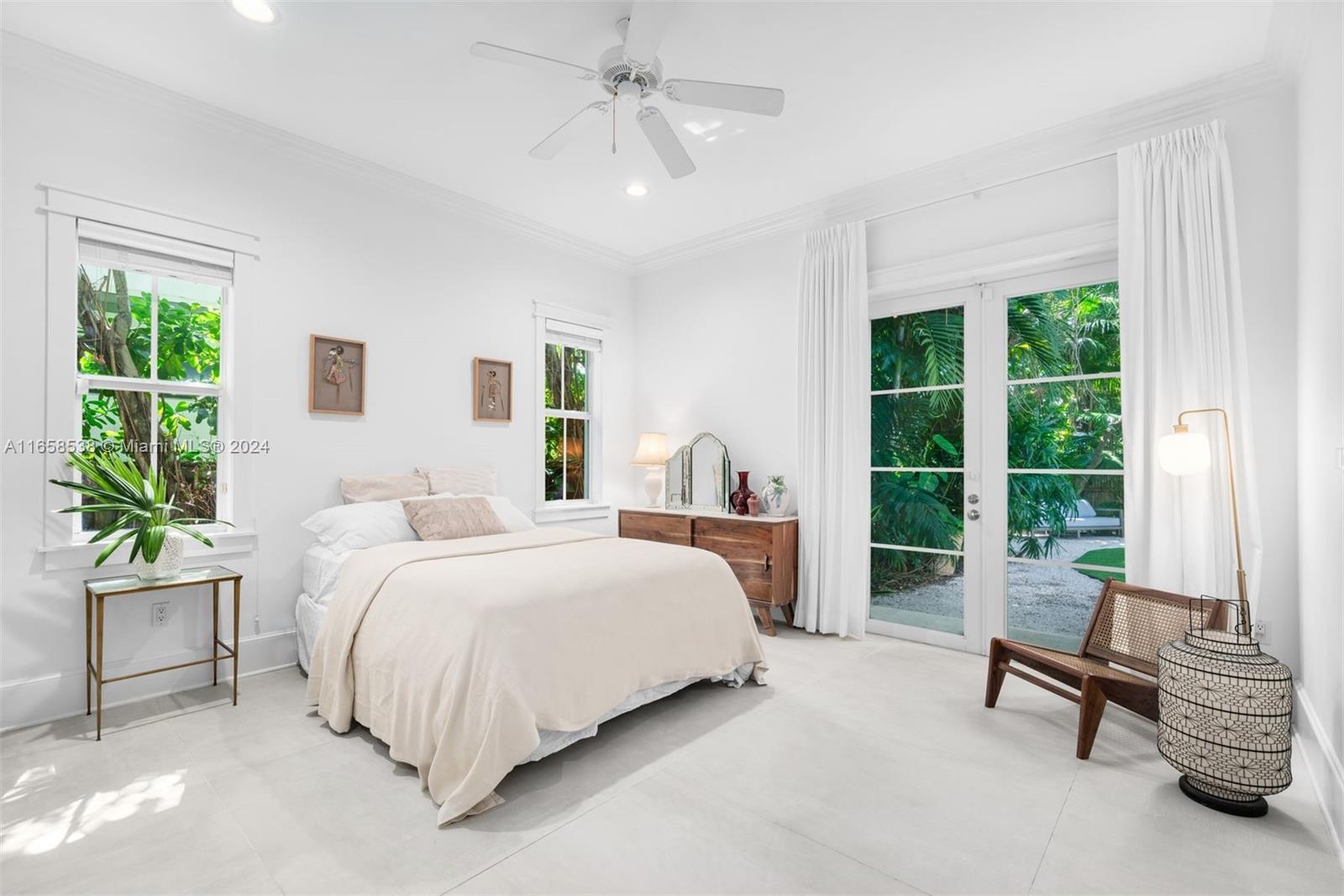 4050 Battersea Road Coconut Grove, FL 33133 - Photo 17 of 40 a bedroom with a bed and a couch
