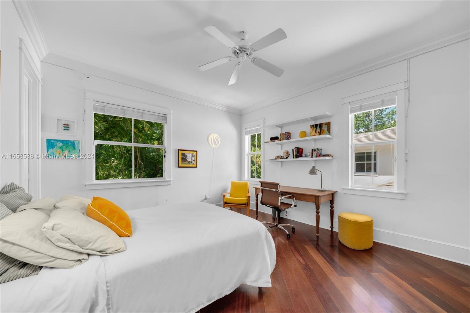 4050 Battersea Road Coconut Grove, FL 33133 - Photo 21 of 40 a bedroom with a bed and wooden floor