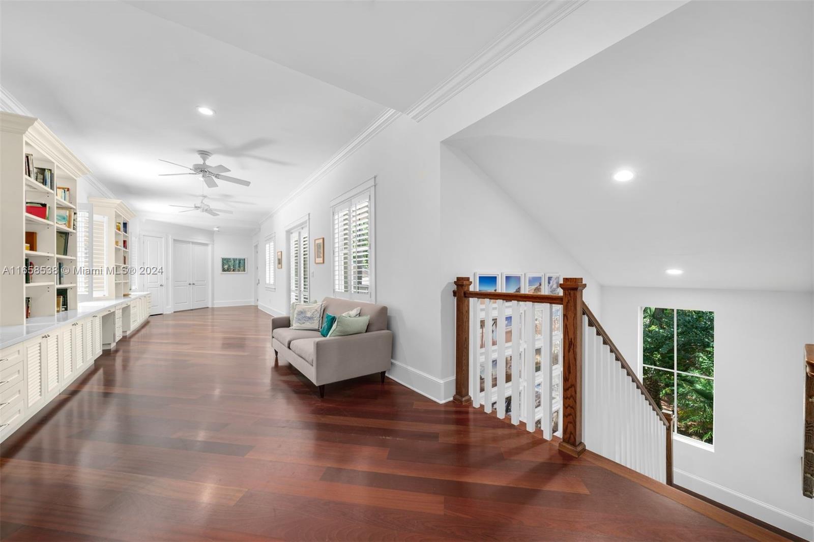 4050 Battersea Road Coconut Grove, FL 33133 - Photo 33 of 40 a living room with furniture stairs and a large window