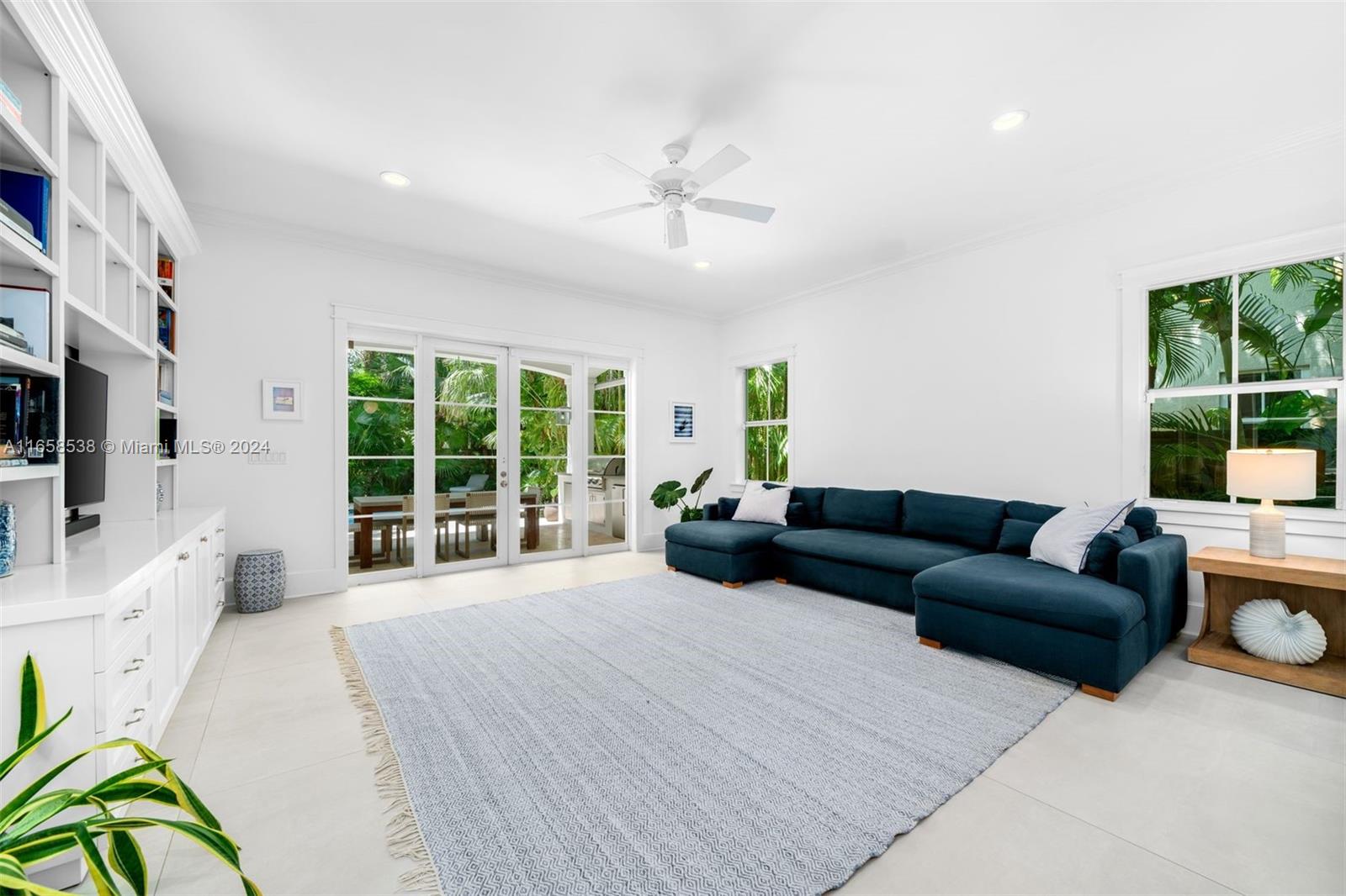 4050 Battersea Road Coconut Grove, FL 33133 - Photo 9 of 40 a living room with furniture and a large window
