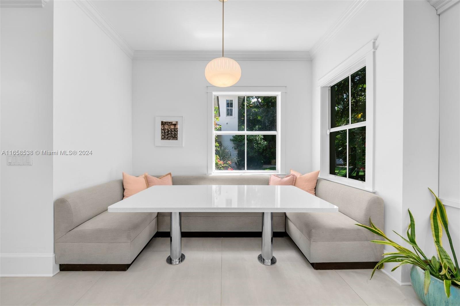 4050 Battersea Road Coconut Grove, FL 33133 - Photo 10 of 40 a living room with furniture and a large window