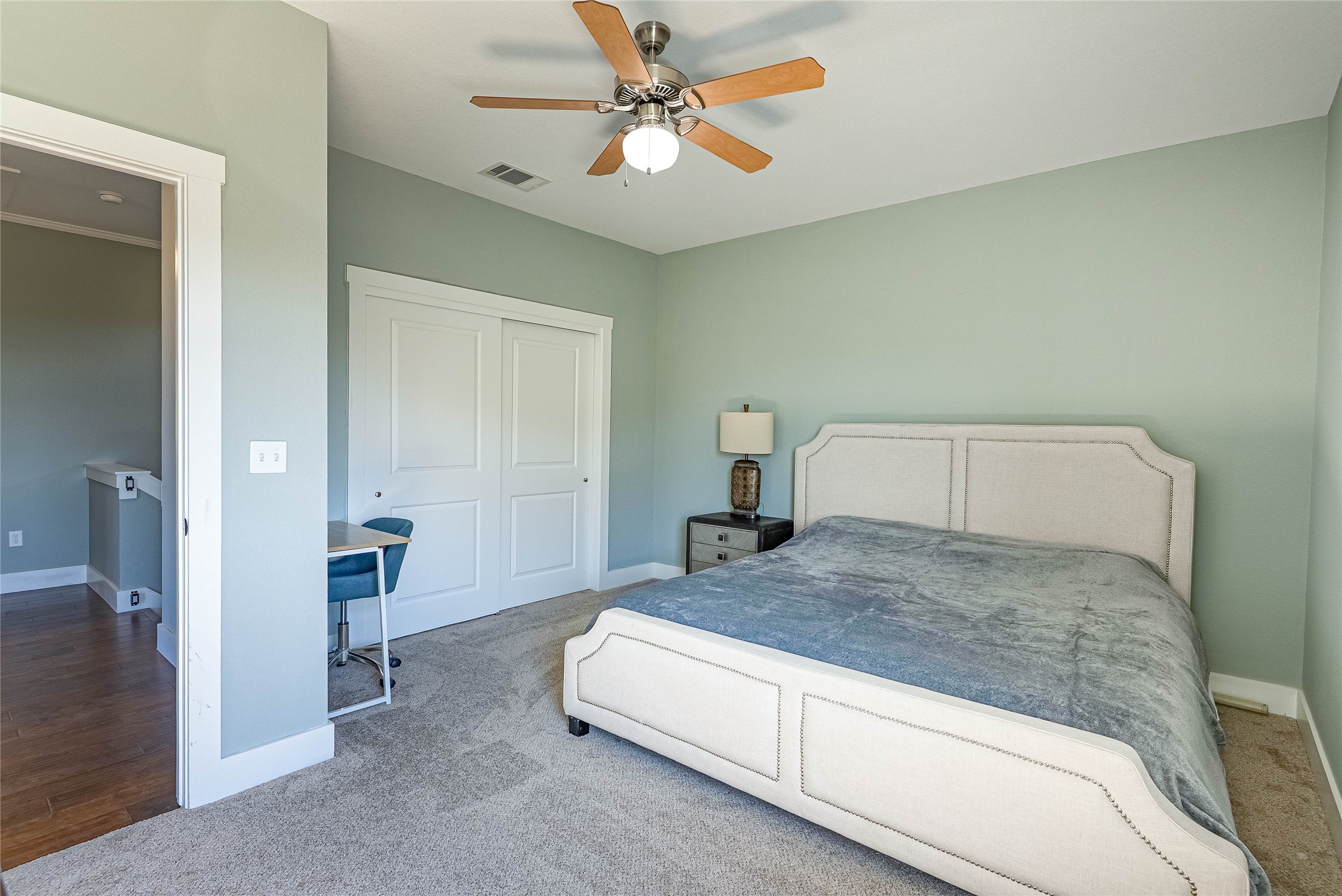 410 Summit Ridge Drive North Point Venture, TX 78645 - Photo 18 of 37 a spacious bedroom with a bed and a chandelier