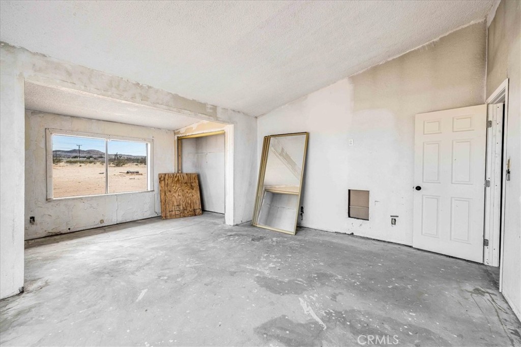 59724 Stearman Road Landers, CA 92285 - Photo 5 of 38 a view of a livingroom with a staircase