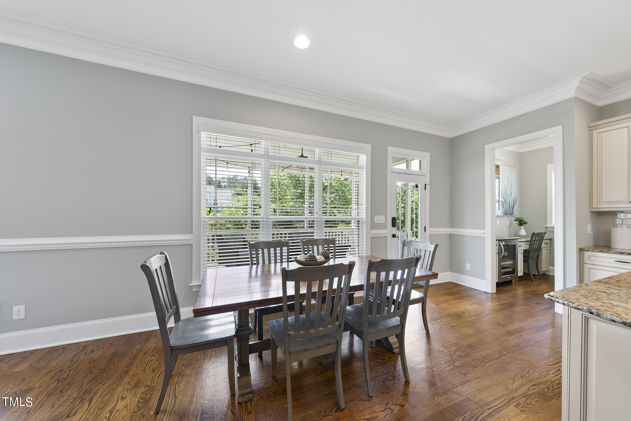 5320 Pomfret Point Raleigh, NC 27612 - Photo 13 of 52 a view of a dining room with furniture window and wooden floor