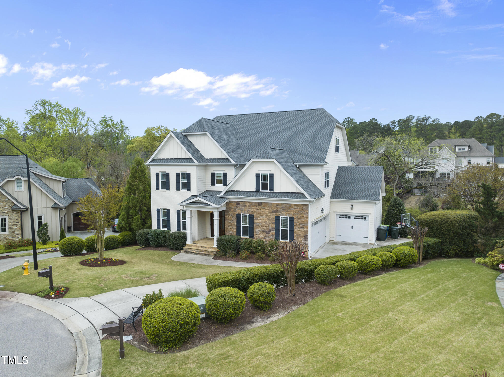 5320 Pomfret Point Raleigh, NC 27612 - Photo 2 of 52 a front view of a house with a yard table and chairs