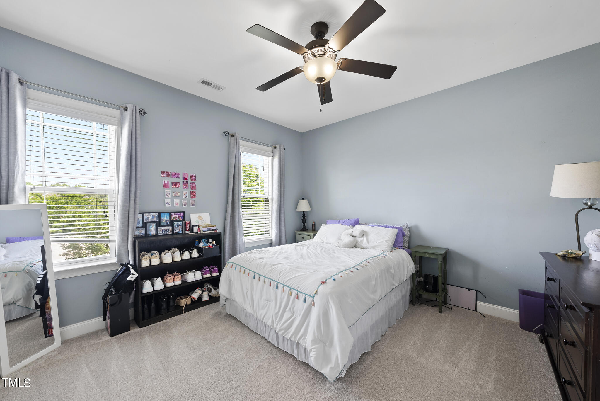 5320 Pomfret Point Raleigh, NC 27612 - Photo 22 of 52 a bedroom with bed and a large window