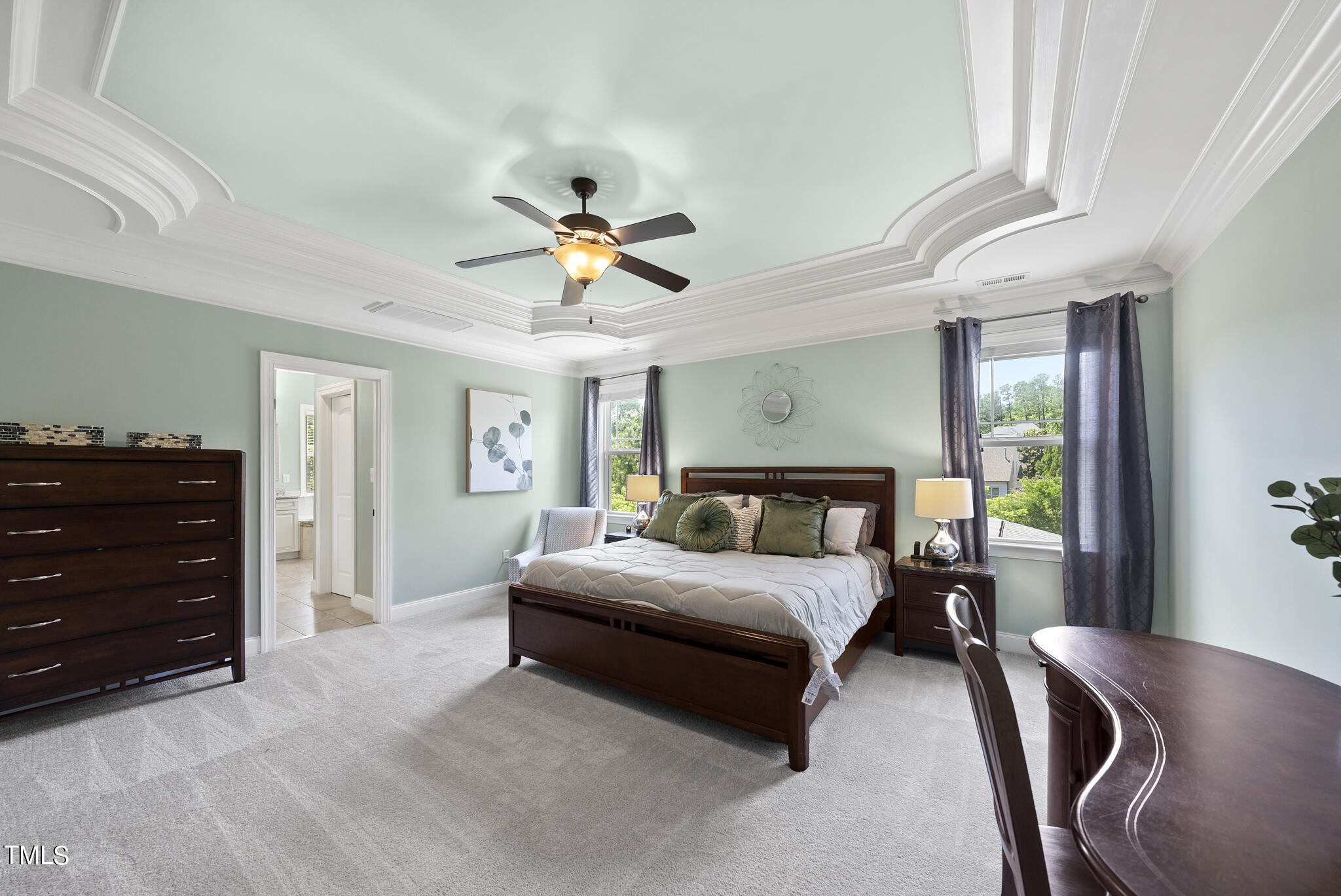 5320 Pomfret Point Raleigh, NC 27612 - Photo 26 of 52 a bedroom with a bed chandelier and a window