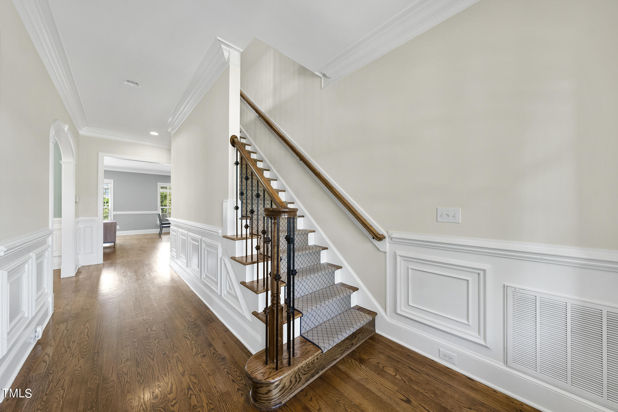 5320 Pomfret Point Raleigh, NC 27612 - Photo 3 of 52 a view of entryway with wooden floor and stairs