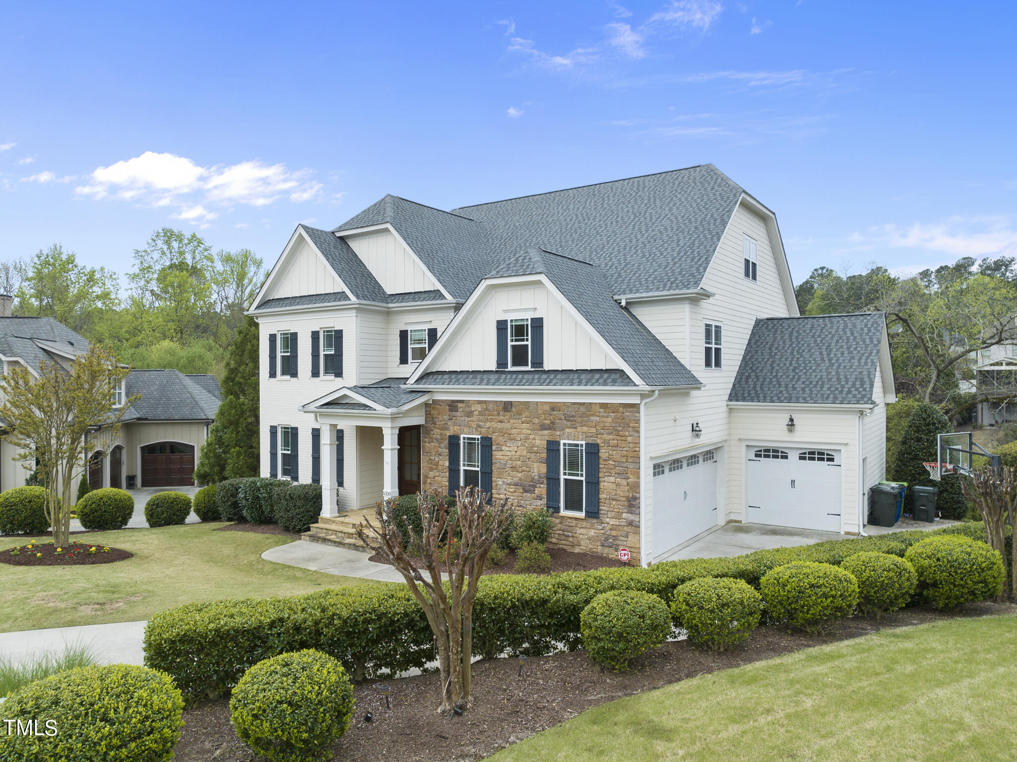 5320 Pomfret Point Raleigh, NC 27612 - Photo 43 of 52 a front view of a house with a garden