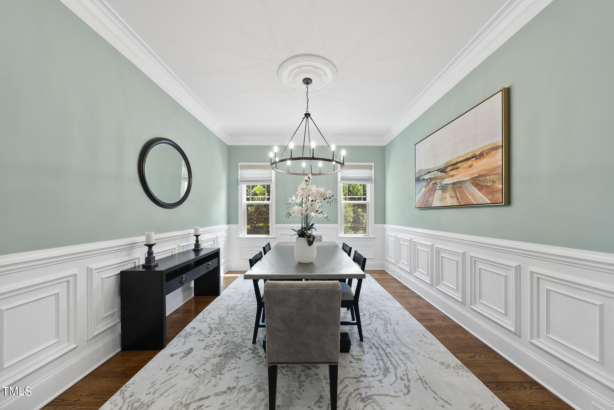 5320 Pomfret Point Raleigh, NC 27612 - Photo 8 of 52 a dining room with wooden floor a chandelier a wooden table and chairs