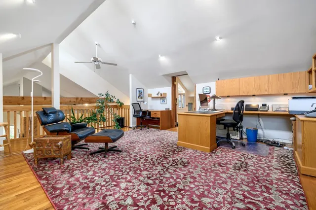 a room with lots of furniture and view kitchen