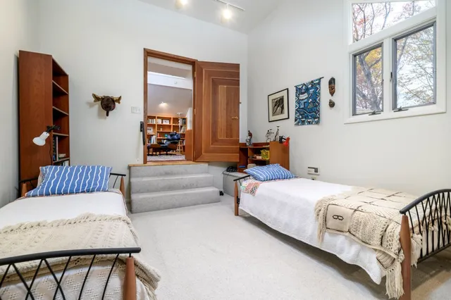 a bedroom with a bed and window